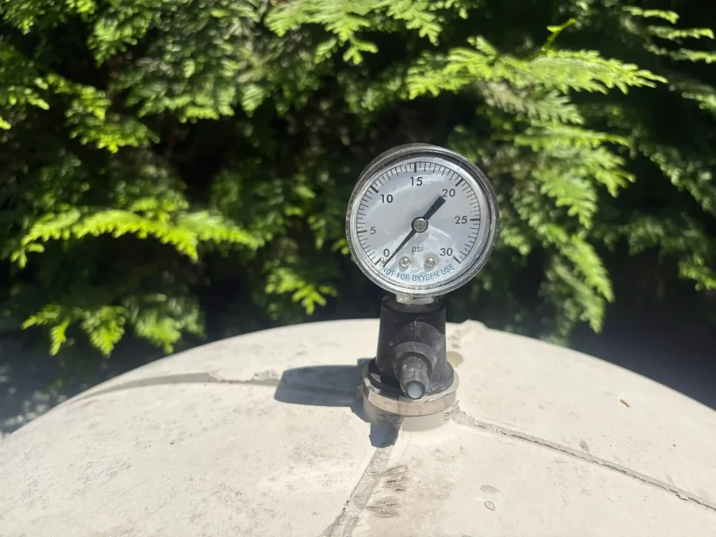 Close-up of a pool filter pressure gauge reading during an equipment service check in Lakehurst, NJ by Gorlin Pools