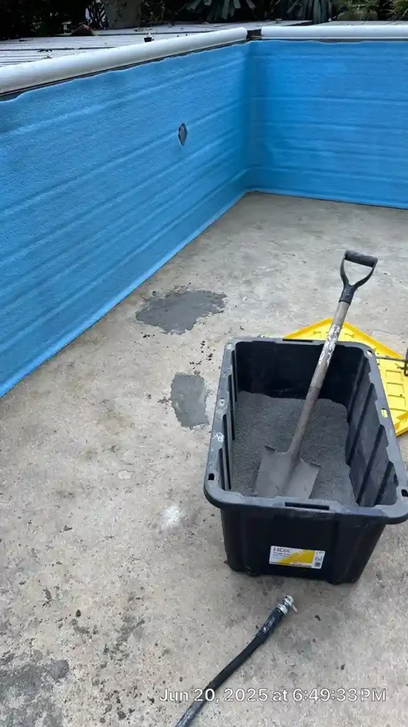 Mortar mix tub with shovel on a patched pool floor next to foam insulation walls during vinyl liner replacement preparation in Lakehurst, NJ by Gorlin Pools