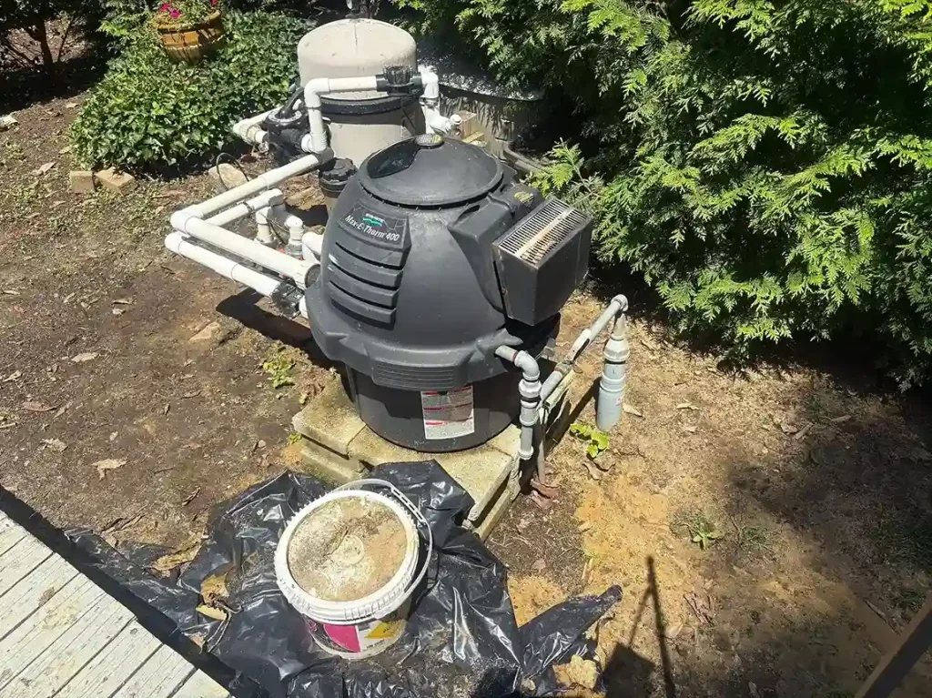 Pentair Max-E-Therm pool heater and filter system on an equipment pad during service in Lakehurst, NJ by Gorlin Pools