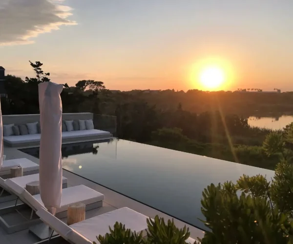 pelican pools - infinity pool on sunset