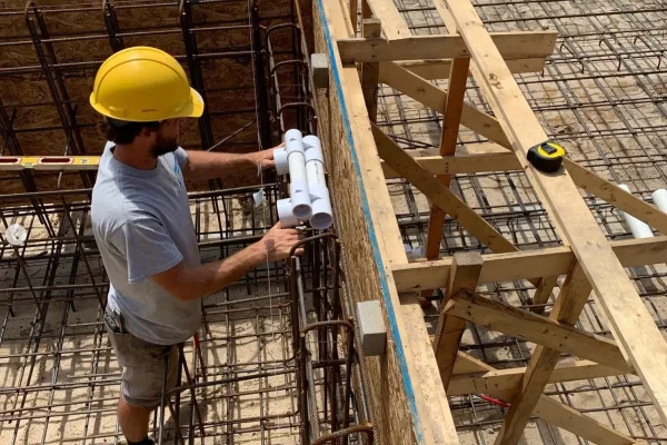 pelican pools - worker in pool construction